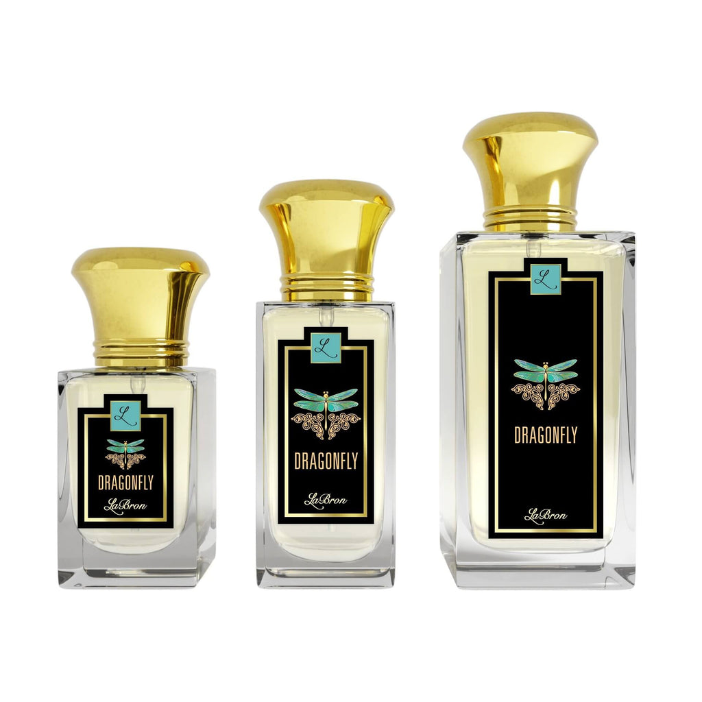 Three sizes of the Dragonfly fragrances laid out in a line with a white background. The label shows a blue dragonfly with a black background with "Labron" on their label. 